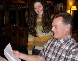 David studying the family tree he requested, and Nacha drew up for us.